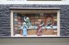Wijde Heisteeg 5. Gevelsteen met een winkelinterieur van een kousenwinkel. (© Walther Schoonenberg)