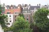 Achterhuizen van Herengracht 506, 508, 510 en 512 gezien vanaf de Keizersgracht (© Walther Schoonenberg)